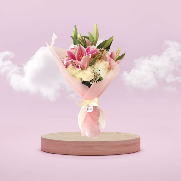 Lily and roses bouquet on a pink show case